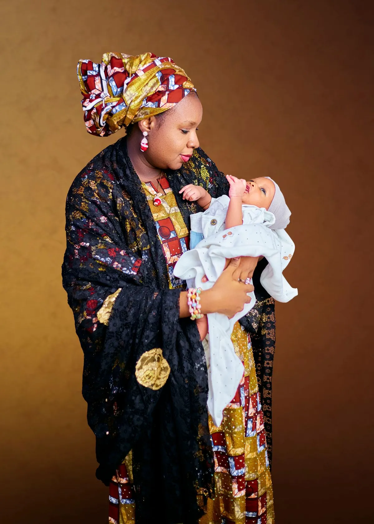 Representative stock photograph of an African mother holding her baby