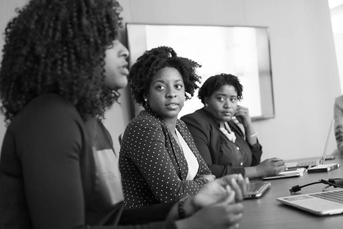 Professionals discussing technology — representative photograph